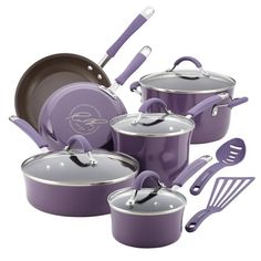 an assortment of purple pots and pans