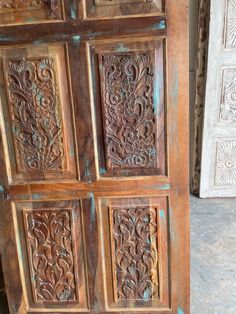 an old wooden door with carvings on it