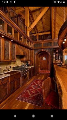 a large kitchen with wooden cabinets and counter tops