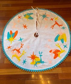 a round rug on the floor with various cartoon characters and stars all over it's surface