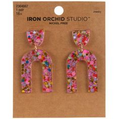 Dimensions: 1.94" x 0.95" x 0.15" Type: Post Material: Resin Color: Pink, White, Red & Blue Metal Color: Gold Age Grade: 16+ Quantity: 1 Pair Stand out in style when you wear these Confetti Resin Earrings! These vibrant earrings feature clear arched shaped that are filled with colorful small pieces of confetti. Above them are abstract shapes that enhance this pair's artistic look. Wear them with a colorful outfit for an enchanting appearance! Colorful Outfit, Resin Earrings, Colourful Outfits, Hobby Lobby, Abstract Shapes, Metal Color, Lobby, Confetti, Red Blue