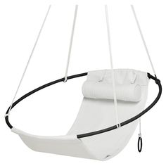 a white swing chair with black straps and a roll on the back end, in front of a white background