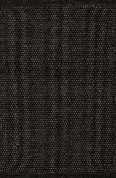 a black area rug with white dots on it