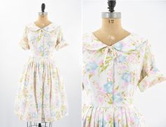 "Vintage late 1950s dress. Poly blend with bright floral print. Peter pan collar, fold over sleeves, darted bust and defined waist. Free skirt. Front button closure. Semi sheer.  State of garment | very good, light overall wear. Measurements ✂--- Best fit |  XL Bust | up to 43\" Shoulders | 15.5\" Shoulder to waist | 16 \" Sleeves | 12.5\" uncuffed Waist | 32- 32.5\" Hips | free Total length (shoulder to hem) | 42\" Tag | Sears  ★★Visit The Shop★★ http://www.etsy.com/shop/seaofvintage ➸ Find the 1950s Collared Daywear Dresses, 1950s Collared Day Dresses, 1950s Collared Spring Dresses, Defined Waist, 1950s Dress, Pan Collar, Peter Pan Collar, Fold Over, Dress Clothes For Women