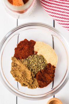 spices and seasonings in bowls on a white table