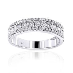 a white gold ring with diamonds on the sides and two rows of round brilliant cut stones