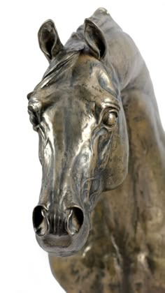 a close up of a horse statue on a white background