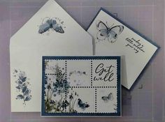 some cards and envelopes with butterflies on them, one is white and the other is blue