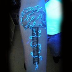 a person with blue lightening on their leg and arm that says thor fear the lightning