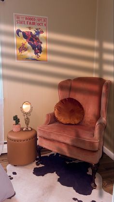 a chair and ottoman in a small room with cow hide rugs on the floor