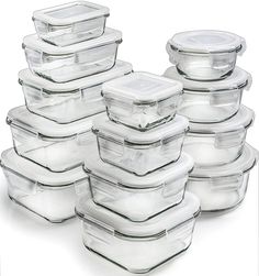 a stack of glass casserole dishes with lids