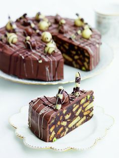 two slices of chocolate cake on white plates