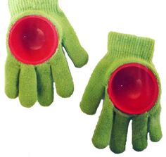 two green gloves with red cups in the middle and one on each hand, both wearing green mittens