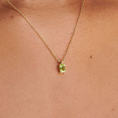 A dainty stone and delicate metallic chain are combined to create this Gold Pendant Necklace in bright peridot, your new favorite wear-anywhere accessory. Peridot is the birthstone of August.   D E T A I L S - Materials: 14k gold-filled. The necklace is made of 14k gold filled which is safe to wear in the shower or in the pool. This necklace is the perfect piece for everyday wear or giving it as a gift. - Stone: natural peridot stone. Peridot is also known as August birthstone. - Pendent size: 4 Peridot Necklace Gold, Peridot Jewelry Necklaces, Birthday Gifts For Wife, August Birthstone Necklace, Peridot Jewelry, Charm Collection, Peridot Pendant, Peridot Necklace, Gold Filled Necklace