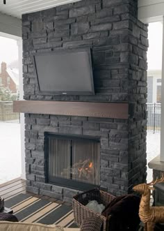 a fireplace with a flat screen tv above it