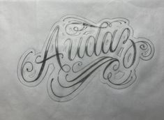 the word amador written in cursive writing on white paper with black ink