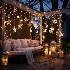 a patio covered in christmas lights and stars