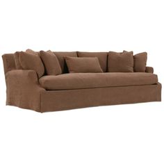 a brown couch with lots of pillows sitting on it's back legs and arms