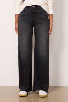 The wide-leg jean you’ll be wearing on repeat. Finished with a full-length inseam, these Paige jeans are crafted in soft stretch denim with a flattering high-rise fit, raw hems, and distressing at the pockets. Take them from day to night with the switch of a shoe. | PAIGE Women's Anessa 31' w Raw Hem Jeans, Black Wide Leg Jeans Black, Chic Black Wide-leg Jeans, Black Relaxed Fit Wide-leg Jeans, Black Wide-leg Jeans With Multiple Pockets, Black Wide-leg Cropped Cotton Jeans, Washed Black Wide-leg Denim Jeans, Paige Jeans, Raw Hem Jeans, On Repeat