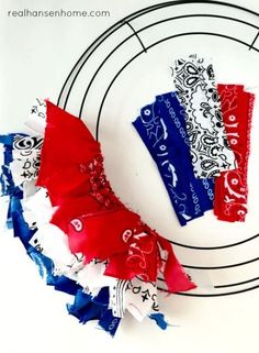 two red, white and blue pieces of paper on a plate