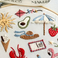 an embroidery project with various embroidered items on it