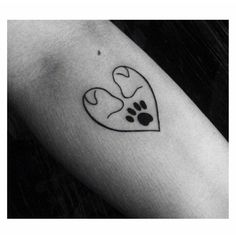 a black and white photo of a paw print on the arm