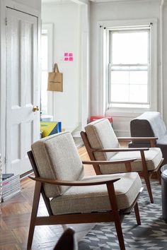 a living room filled with furniture next to a window