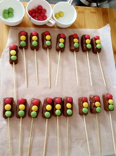 there are many candy lollipops on the table