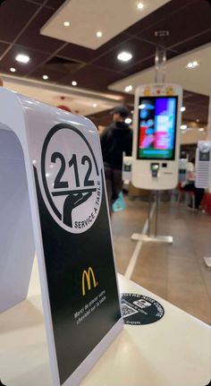 a mcdonald's restaurant sign in the middle of an airport