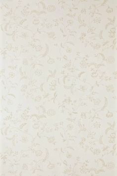 a white wallpaper with small flowers on it