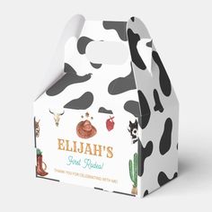 a cow - print milk box is shown with the label for eliah's