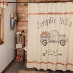 a bathroom with a shower curtain that says pumpkin pick't this way