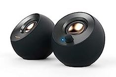 two black speakers sitting next to each other