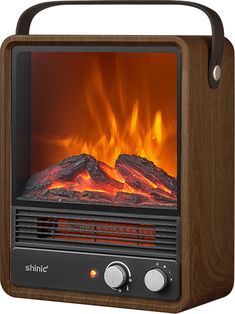 an electric fireplace heater with flames burning in the back and logs on the front