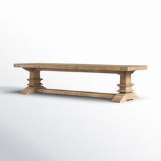 a wooden bench sitting on top of a white floor