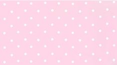 a pink background with white polka dots