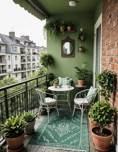 a balcony with potted plants and chairs