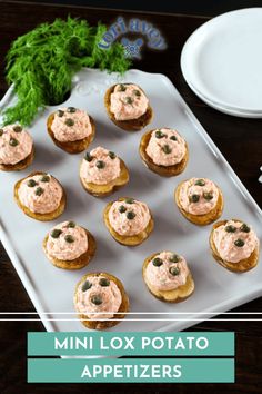 mini lox potato appetizers on a white plate with green garnish