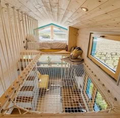 the inside of a tiny house with lots of windows