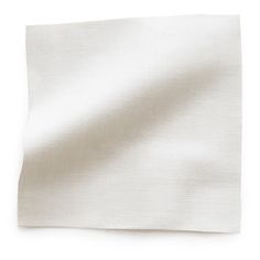 a white napkin folded on top of a table