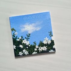 an acrylic painting of white flowers against a blue sky with the words, clouds