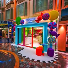 a brightly lit store front with colorful decorations