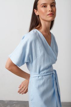 "SUMMER is a short sleeve true wrap closure linen wrap dress. DETAILS - True wrap closure - Dolman style sleeves - Knee length - 100% lightweight European linen fabric - Cut and sewn to order just for you in our studio COLOR - Baby Blue, you can also choose other colors above - Fabric samples are available here https://www.etsy.com/listing/586569696/linen-fabric-samples SIZING & FIT - Relaxed fit - True to size - Model is 5'9.5\" / 177cm and wearing a size XS CARE FOR LINEN - Machine wash up to 30ºC/86ºF gentle cycle - Lay flat to dry or tumble dry low - Warm iron if needed - Do not bleach SIZE GUIDE Size conversion guide Size XS (US 0-2, IT 36-38, UK 4-6, Japan 3-5, France 32-34) Size S (US 4-6, IT 40-42, UK 8-10, Japan 7-9, France 36-38) Size M (US 8-10, IT 44-46, UK 12-14, Japan 11-13, Summer Wrap Dress, Kimono Wrap Dress, Linen Wrap Dress, Linen Kimono, Sparkly Accessories, Kimono Wrap, Summer Linen Dresses, Summer Linen, House Dress