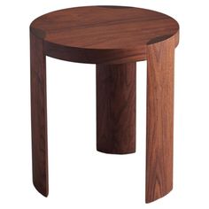 a small wooden table that is made out of wood and has an oval shaped top