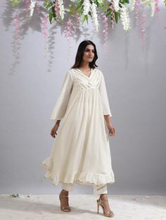 Jameela ivory tunic - Trendroots Elegant Off White Cotton Kurta, Bohemian Off White Straight Kurta, White Anarkali Kurta With V-neck, Festive Long Sleeve Kurta With Back Tassel Tie-up, Traditional Cotton Kurta With Back Tassel Tie-up, White V-neck Festive Kurta, Festive White Tunic Set, Cream Cotton Anarkali Kurta, Cream Anarkali Cotton Kurta