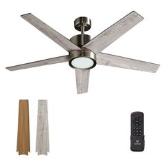 a ceiling fan with three blades and two remote controls next to it, including one light