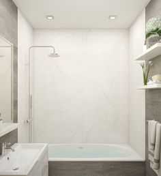 a bathroom with a bathtub, sink and shower head mounted to the side of the wall