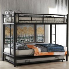 a metal bunk bed sitting in a bedroom next to a wall with paintings on it