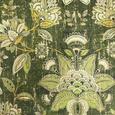 a green and white floral pattern on fabric