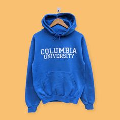 Columbia university spell out hoodie Columbia university sweater pullover streetwear college style blue colour size small  Carefully check our flat lay measurements and compare to your closet that fits you, don't measured by tag. The years, style, and where manufactured simply affect sizing for this pre-owned clothing. Please check measurements and compare to your favorite garments for proper fit (Item measured with ±1cm differ and taken on flat ground).  Brand Name :- Columbia university  📌 Tag Size :- Fit small  Manual Measurement :- WIDTH (armpit to armpit) :- 20 inches  LENGTH (shoulder to end of garment) :- 25 inches end SLEEVE (shoulder to of sleeve ) :- 30 inches  Condition: Please view the photos for signs of wear as these vintage items may have signs of natural vintage wear, and University Sweater, Columbia College, Columbia University, College Hoodies, University College, College Style, Streetwear Style, Sweater Pullover, College Fashion